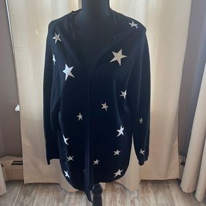 Black and white star cardigan type sweater.